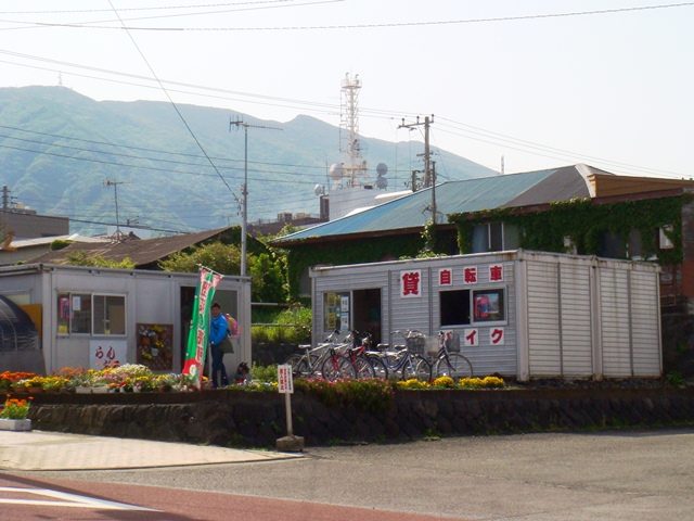 A small bicycle rental shop with bicycles parked in front